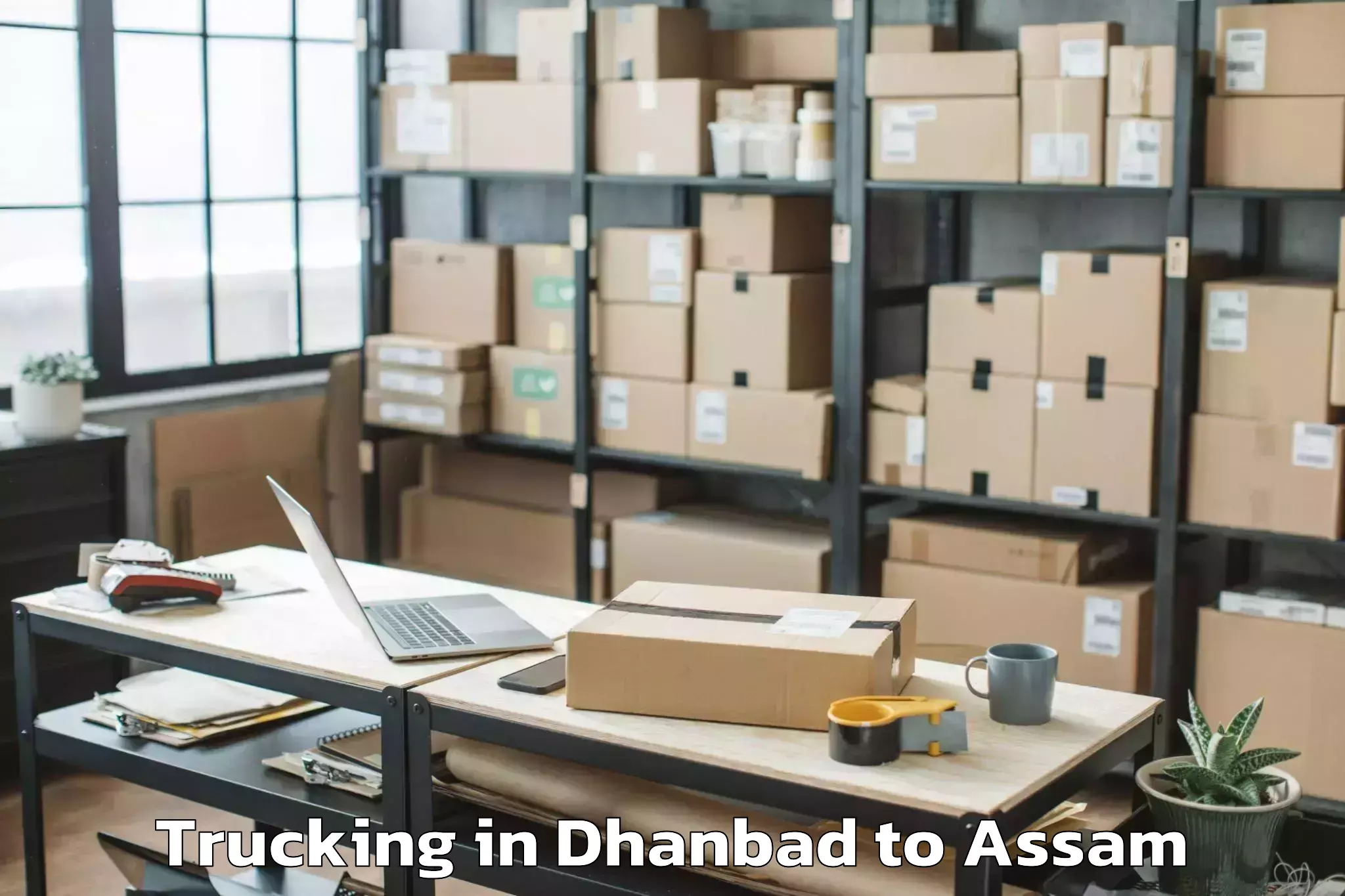 Leading Dhanbad to Dergaon Trucking Provider